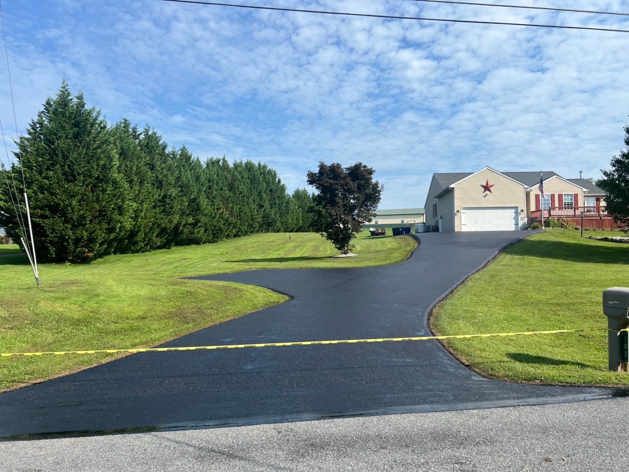 A freshly paved asphalt driveway on a warm, dry day in Berks County, PA
