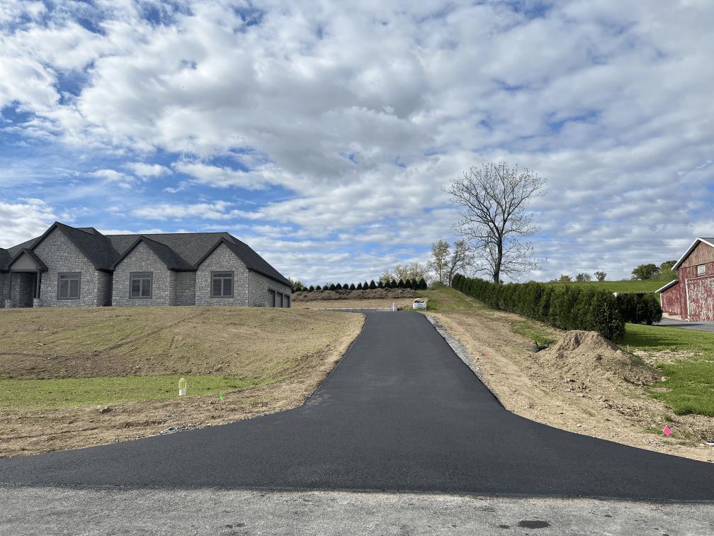 A newly paved asphalt driveway on a solid stone base in Berks County, PA